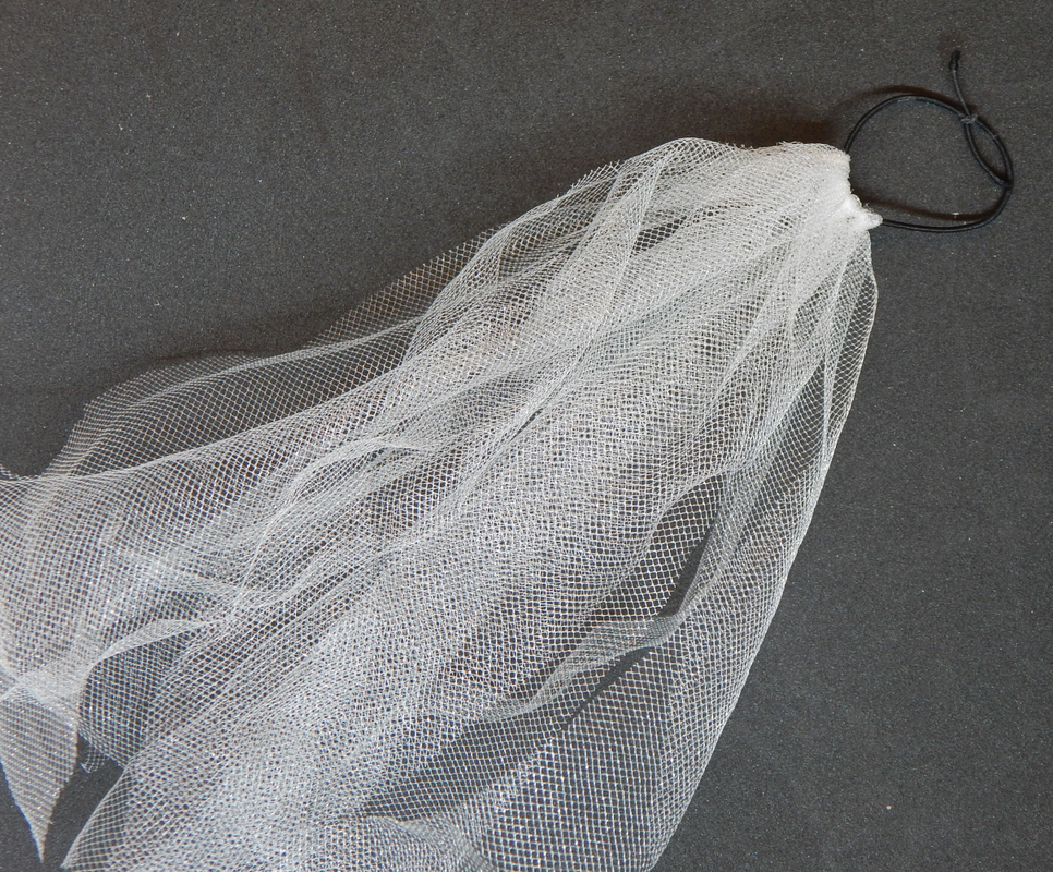 Multiple pieces of tulle attached to a black elastic band